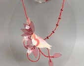 Fine art floral jewelry with red bird and textile flowers. Romantic necklace made of linen and silk.