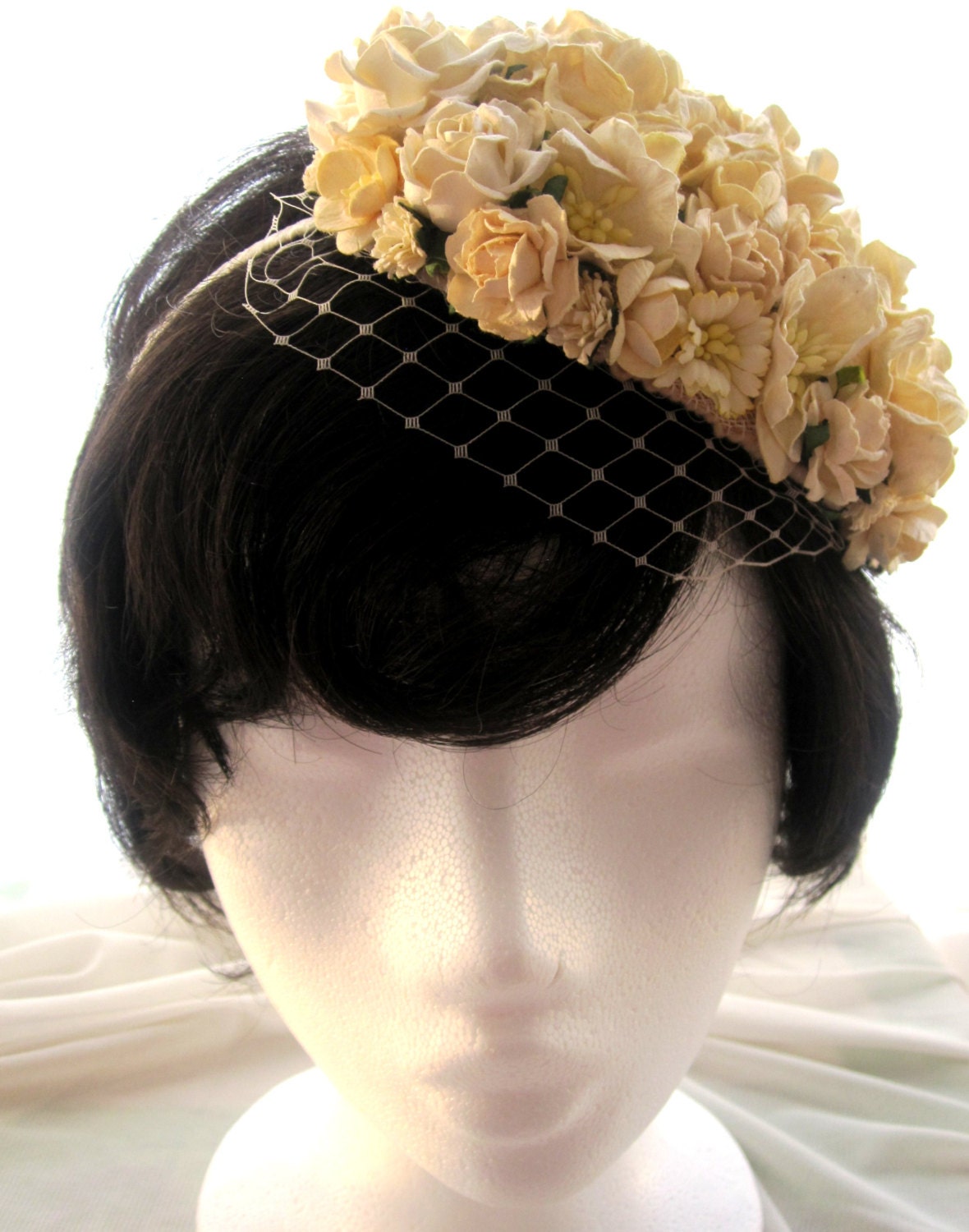 Vintage look bridal floral headpiece with ivory flowers and veil