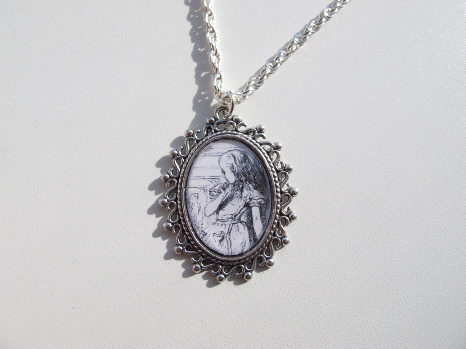 Alice in Wonderland necklace, John Tenniel Illustration in black and white.