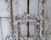 White ornate wall frames accented in gray pewter and deep gold French farmhouse wall decor Anita Spero