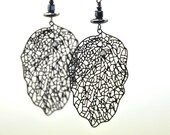 Beautiful earrings, made with Black lasercut filigrees and gunmetal crystal beads