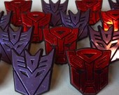 Transformers logo shield cupcake rings picks or cake toppers, great for your next robot boy birthday party or as treat bag favors