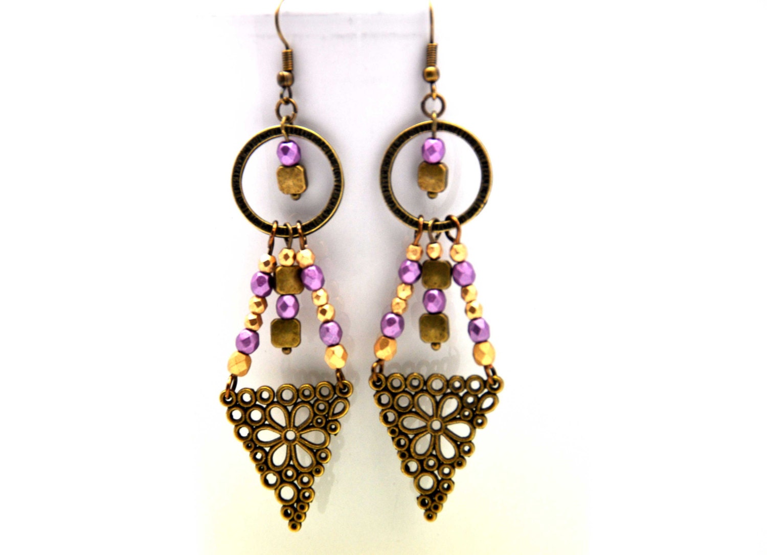 Delightful earrings made with metallic matte lilac and gold faceted czech crystal beads and antiqued brass filigrees