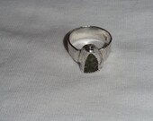 Handmade solid sterling silver peridot ring with handcrafted fine silver bezel.  Size 7 1/2.  Rustic