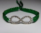 Infinity Bracelet in silver metal with rhinestones and emerald green cord