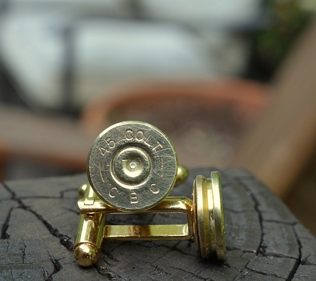 Bullet cufflinks fashioned from repurposed gold/brass CBC .45 Long Colt shell casings