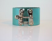 Three Ball Clasp on a Metallic Leather Bracelet