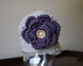 Newborn brim hat with large button flower. Sizes newborn to toddler