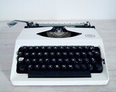 vintage manual portable typewriter with hard case, pinnock 100 from australia