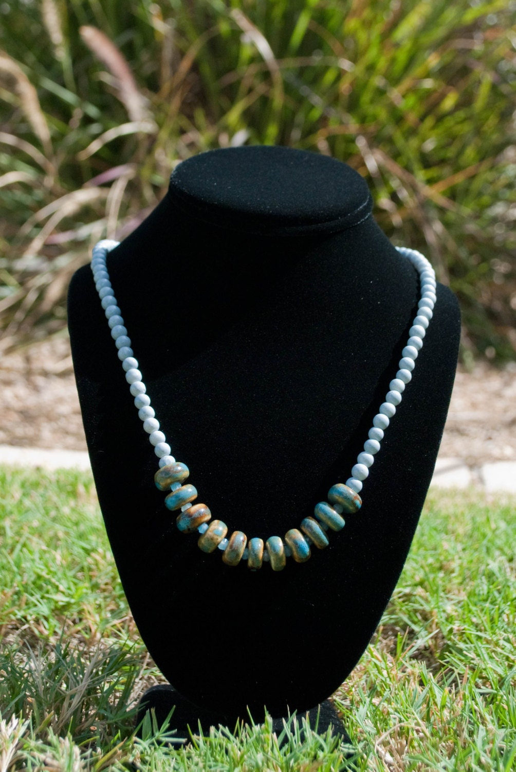 Items similar to Grey Jelly Bean Glass and Blue Ceramic Beaded Necklace on Etsy