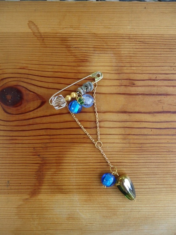 Grass and the Water Droplet: pin with ocean, sky blue, and gold and green-tone glass beads, gold chain