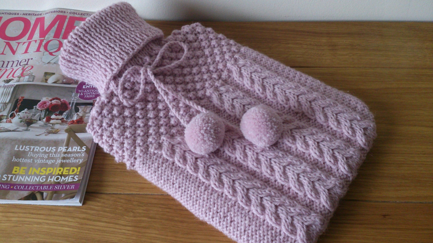 Pink hand knitted hot water bottle cover complete with bottle - cable and blackberry stitch design with pompoms - Ready to Ship - DottyKnits