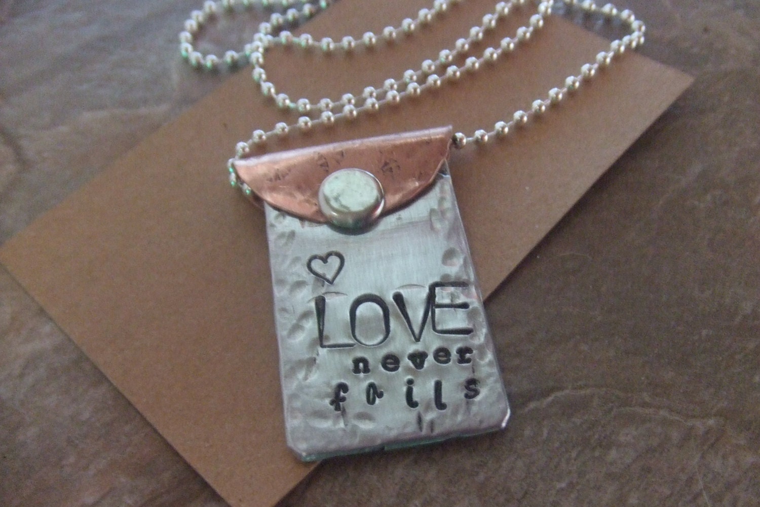 Handstamped Copper and Silver Necklace - Love Never Fails - Mixed Metal - BraceletsbyLinda