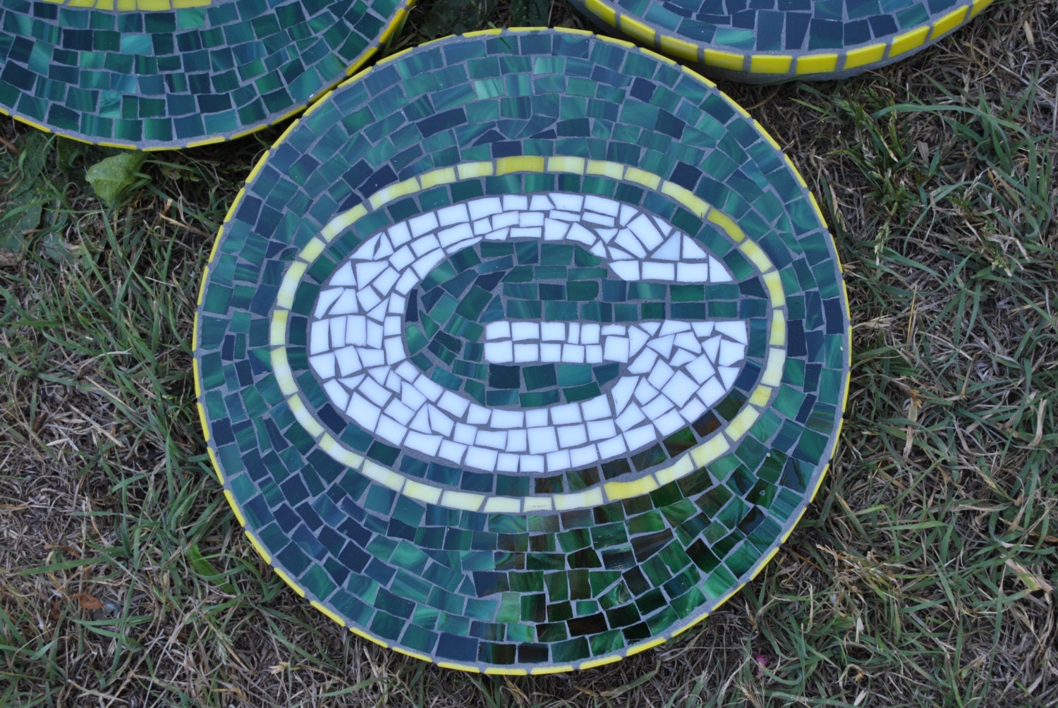 Custom designed football team mosaic garden by midcenturymosaics