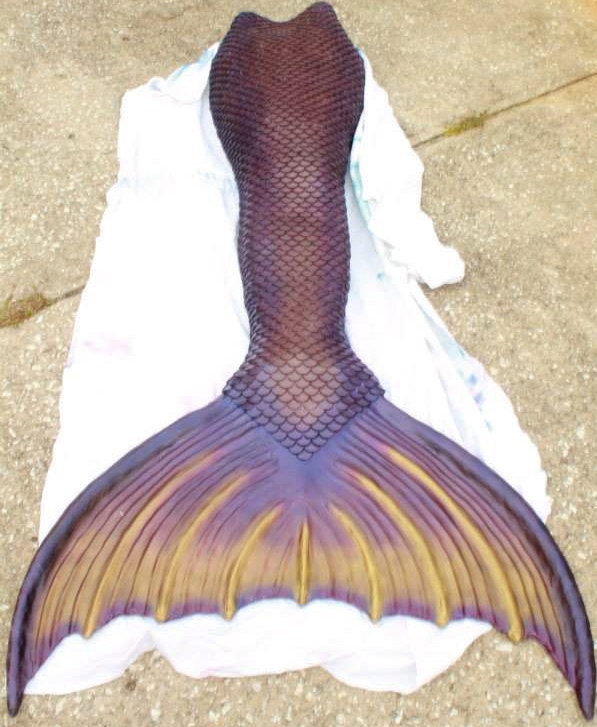 Her silocone mermaid tail