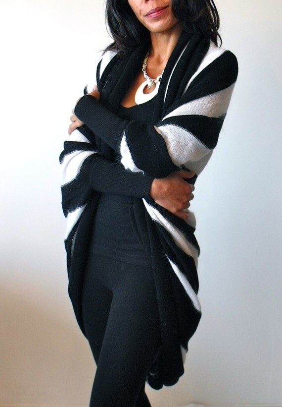 Black Angora Shrug 80% Angora, black shrug, in excellent used condition. Looks great over a strapless dress -my sister wore this over the strapless black French Connection dress posted in my closet for a holiday party, and she got so many compliments. See measurements in pics, and ask questions if interested.