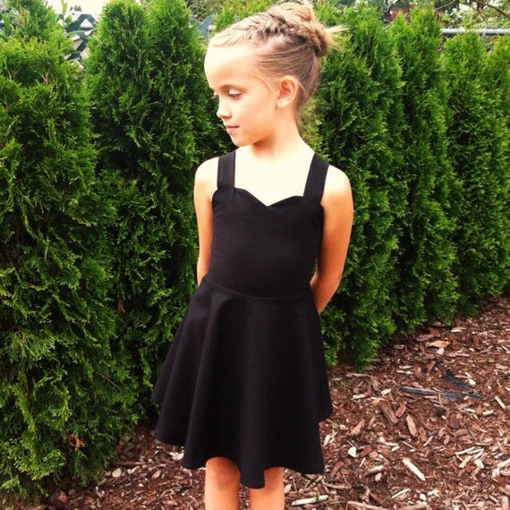 Girl playing tiny black dress