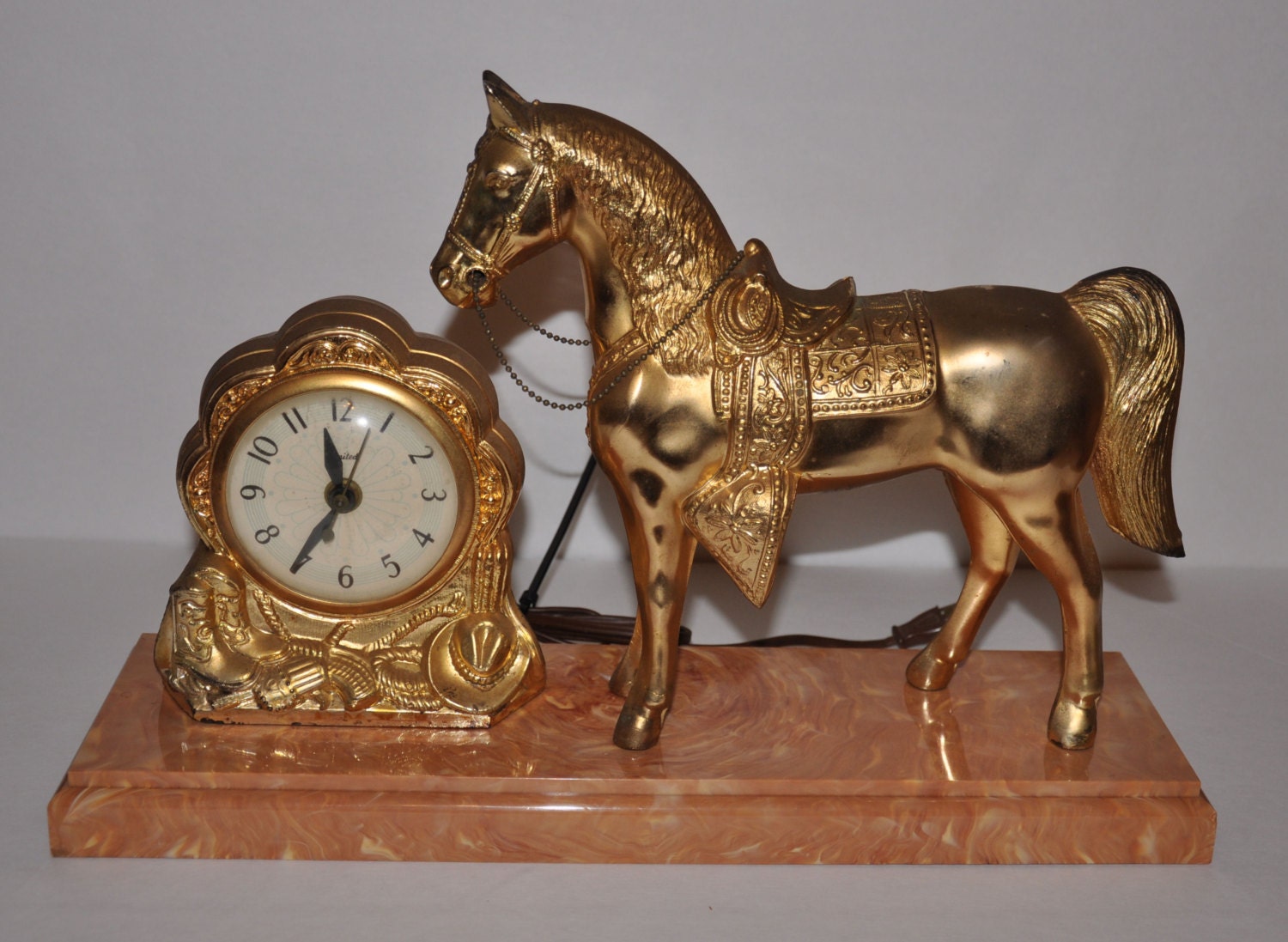 Items similar to Vintage Metal Horse with United Clock Corp Clock on Etsy