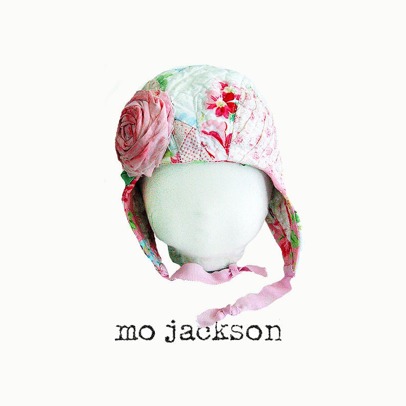 baby hat with earflaps made out of vintage quilt with handmade flower