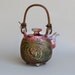 teapot green red cozy