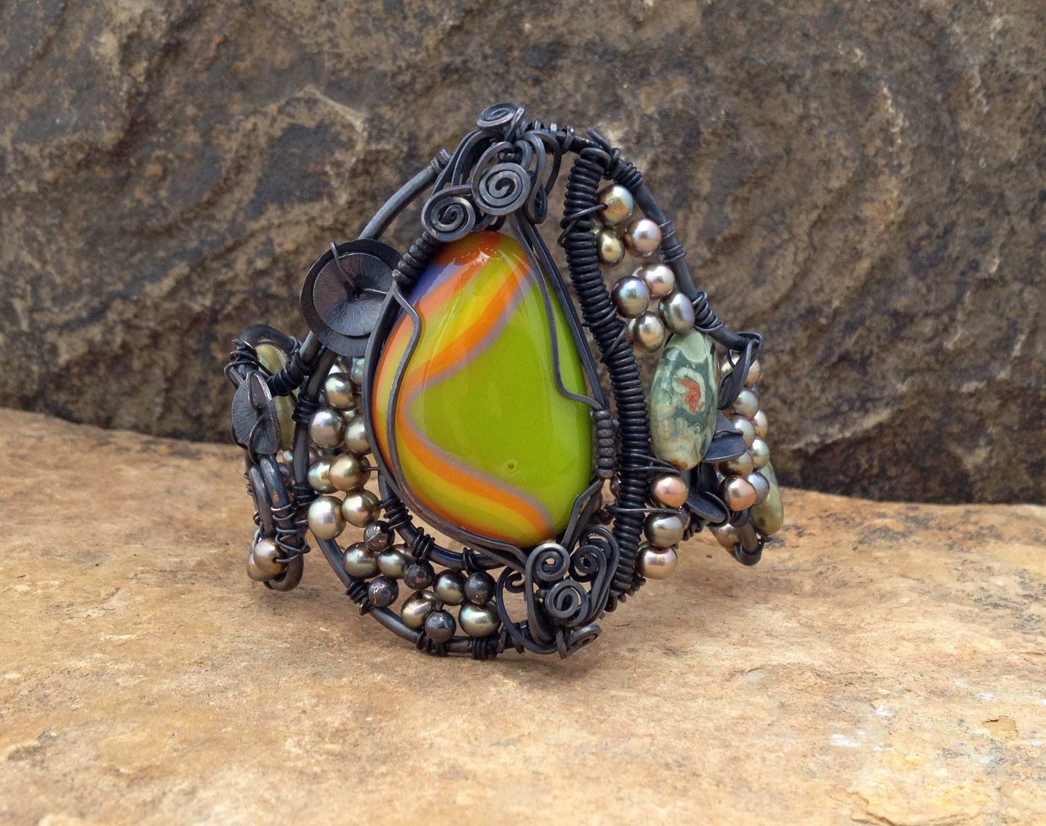 Unique one of a kind wire wrapped oxidized copper cuff bracelet with a beautiful green,orange, yellow and lavender fused glass cabochon - silverlv