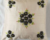 Cream throw pillow with black floral ribbon work ON SALE