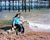 Cara and Daisy Under the Pier, Brighton, England.  2010