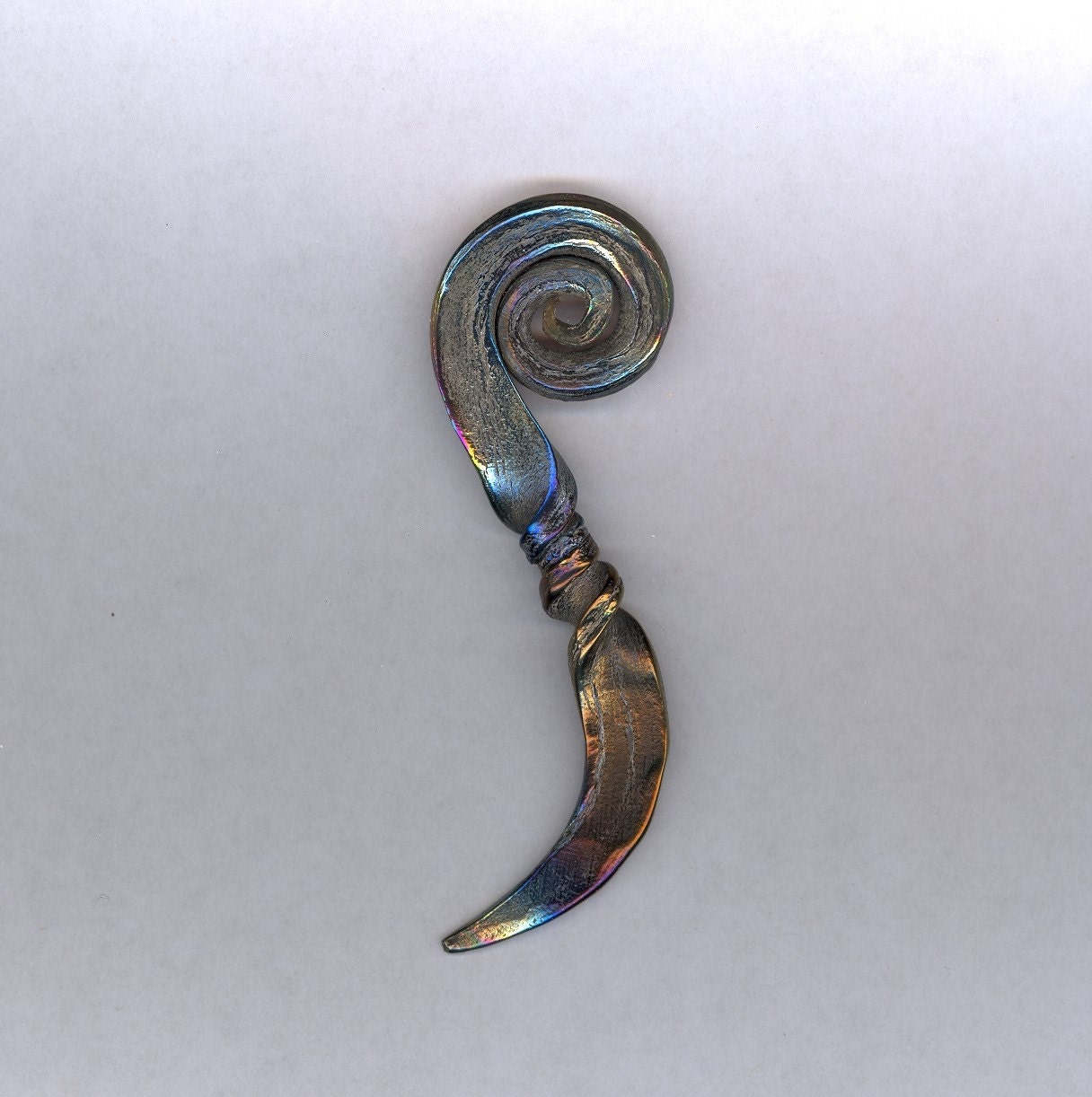 Hand forged titanium nut pick