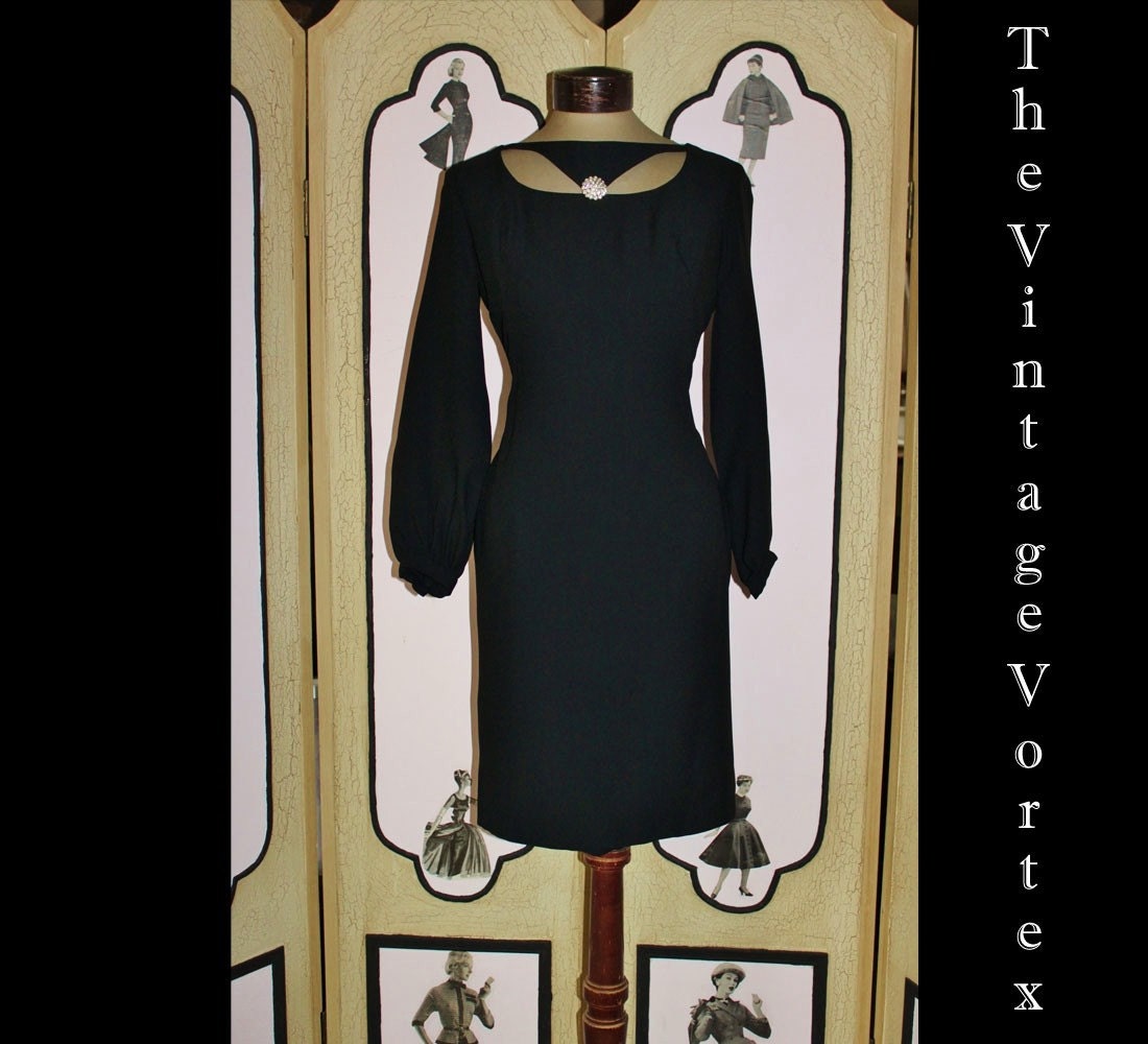 Vintage 1960's Black Cocktail Dress with Avante Garde Neckline. Small 36 Bust.