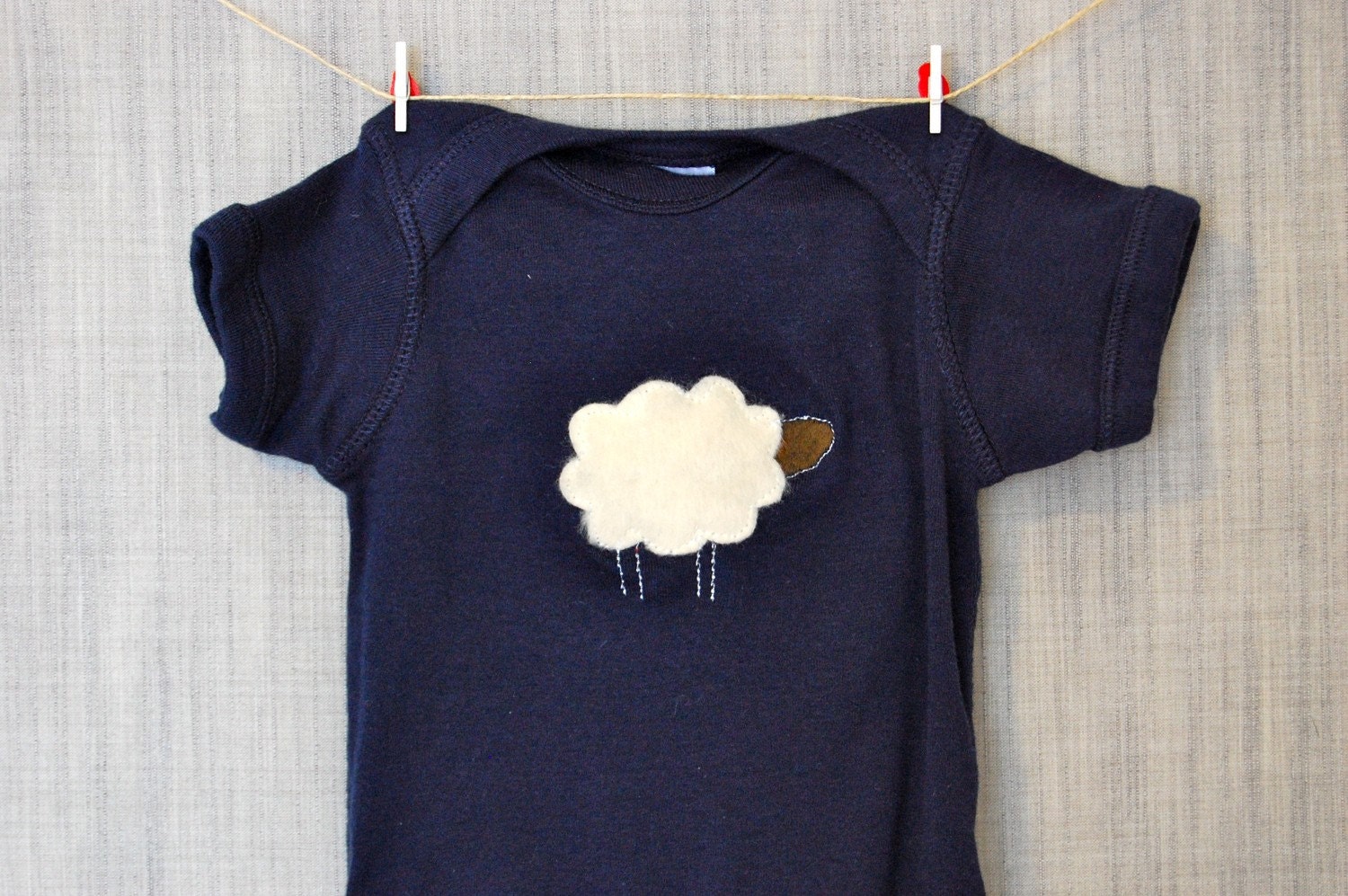 Onesie with adorable fuzzy sheep for a baby boy or girl