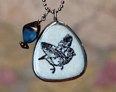Black and White Bird Necklace with Blue Bead