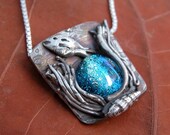 fish, seaweed, shell, silver pendant with dichroic glass cab