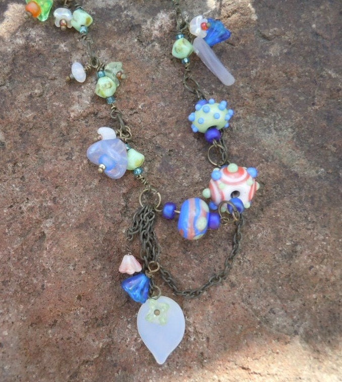 Spring is in Bloom with the Asymmetrical Necklace Full of Glass Blossoms and Beautiful Lampwork Beads