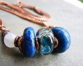 snowy white quartz, lapis lazuli, lampwork glass bead, sodalite surrounded by copper necklace