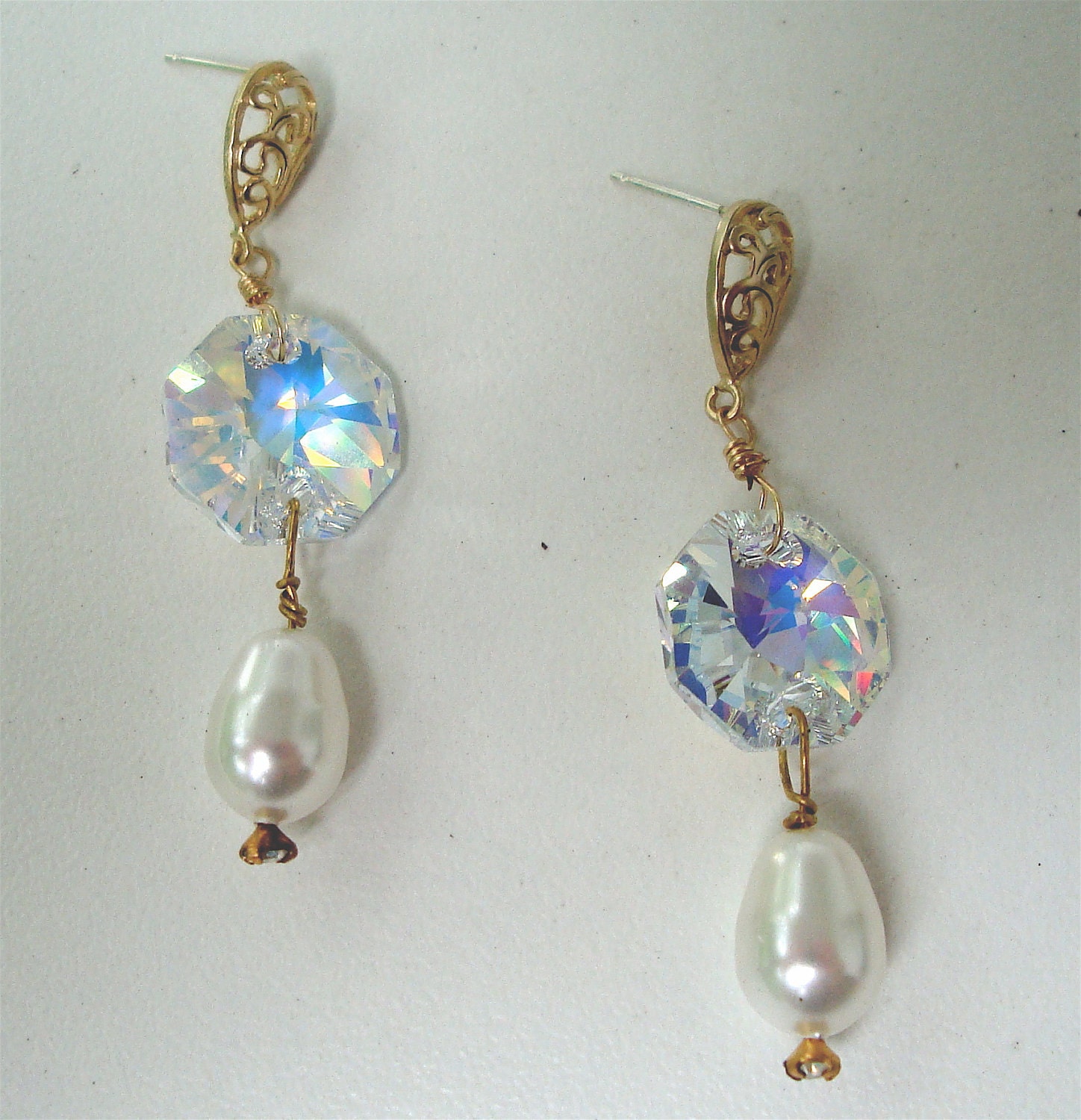 Matte gold vermeil earring with paisley design and sterling silver post, swarovski crystal connection to swarovski crystal pearl