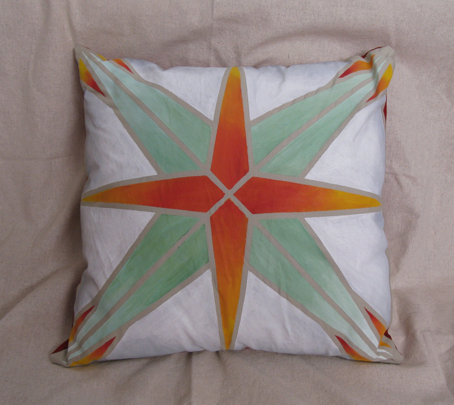 Green and orange starburst pillow cover
