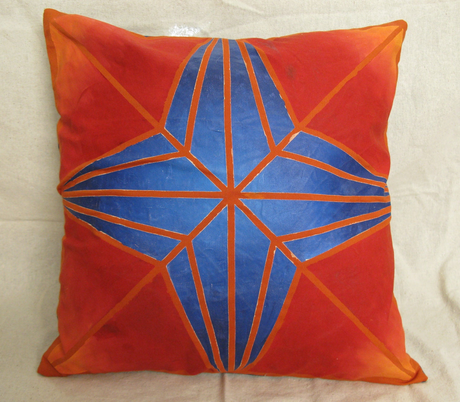 Bright blues and reds starburst pillow cover