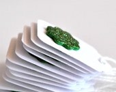 12 Green Glitter Sunburst Mini Tags Threaded White