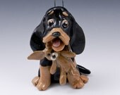 Black and Tan Coonhound Ornament with toy bunny Porcelain Sculpture