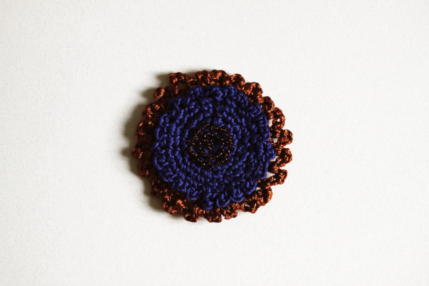 Blue and brown crochet pin