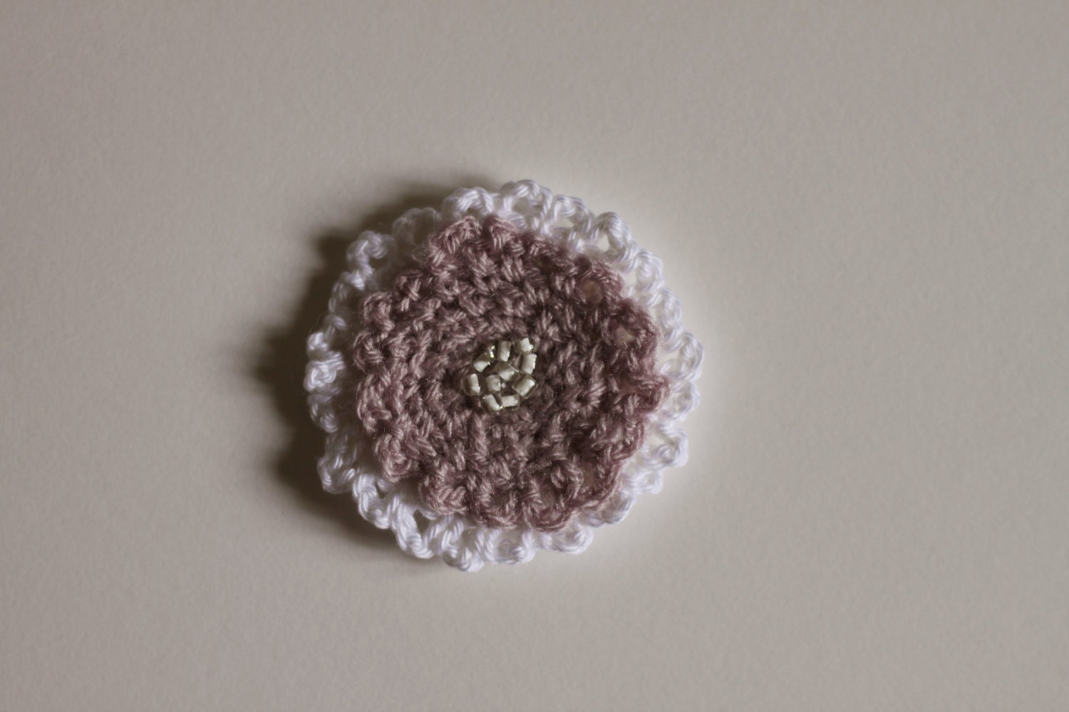 White and purple crochet pin