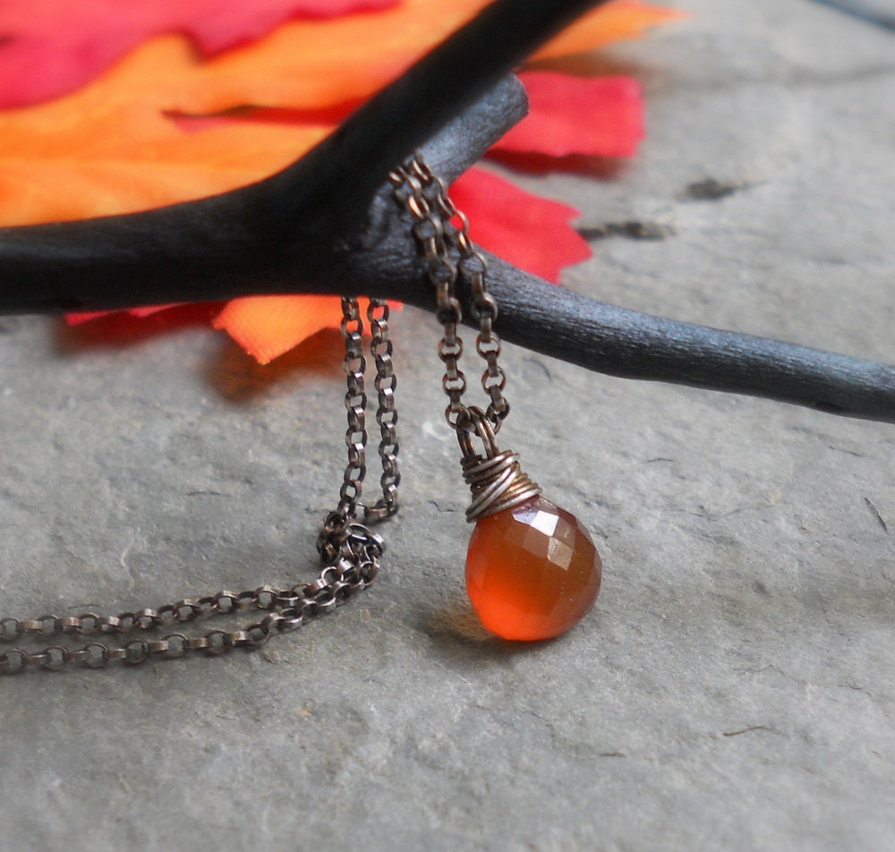 Honey Drip - Petite, faceted hessonite briollette on oxidized sterling silver
