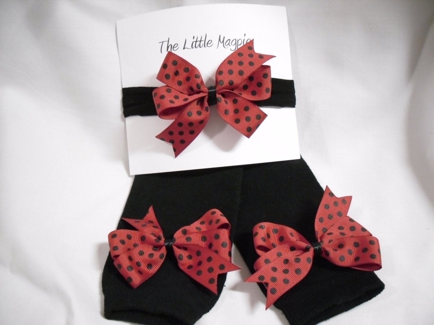 Black legwarmers with red and black polka dot bows and matching headband
