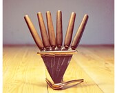 Danish butter knifes on a stand. A set of 6. Steel and teak wood.