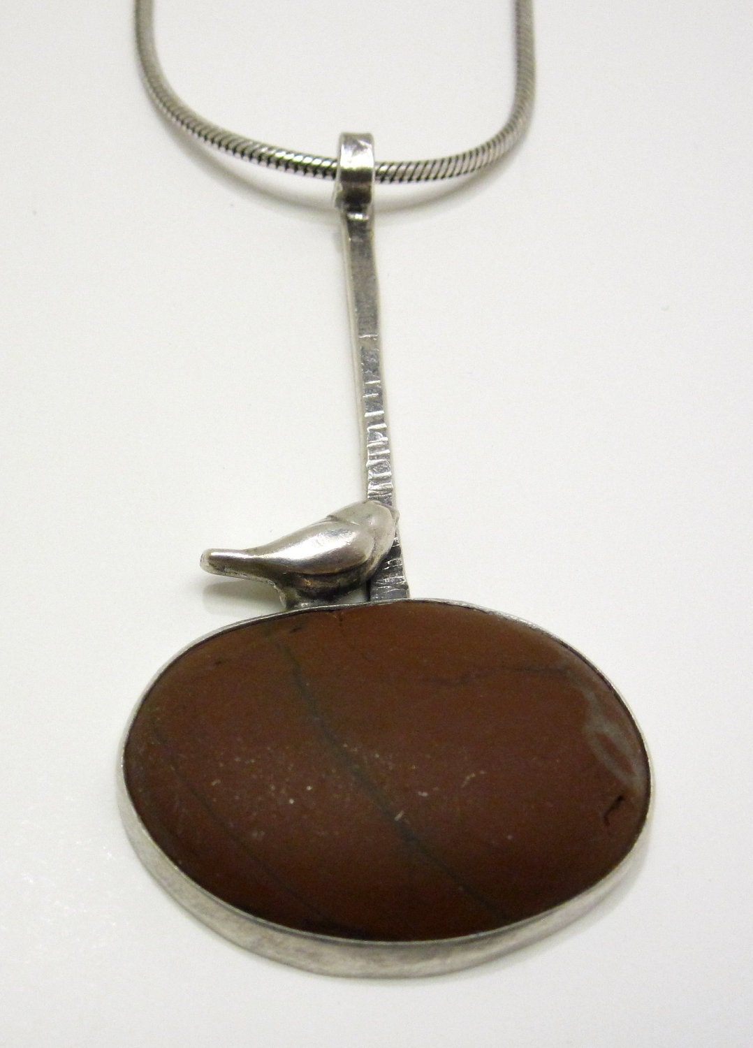 Silver Bird on Bezel Set Ocean Stone
