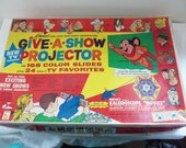Vintage cartoon projector, Kenners give a show projector, baby boomer cartoons, every piece included, excelent condition
