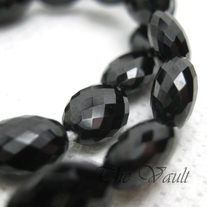 4 Black Spinel 9-10mm faceted flattened oval beads
