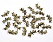 10 Antique Bronze Bow Jewlery Connectors 16x8mm FREE Shipping if purchased as a 2nd item in the US or Canada. Ships today.