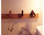 Custom made wooden bedside kit. Movable pins. Can be customized to fit every room of the house.