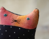 A small ornamental textile kitten called Dot